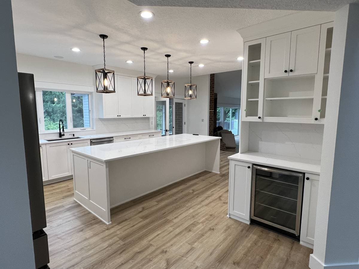 Picture of a newly remodeled kitchen with luxury countertops and cabinets and new flooring