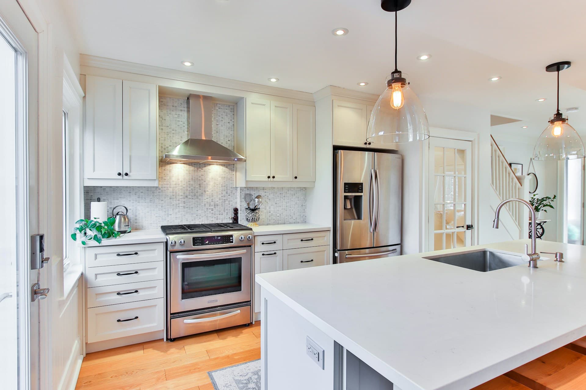 Picture of a newly remodeled kitchen with luxury countertops and cabinets and new flooring